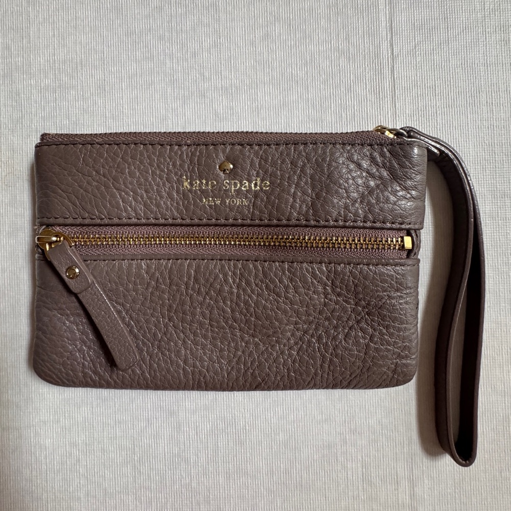 Kate Spade New York pebbled leather wristlet. Taupe color